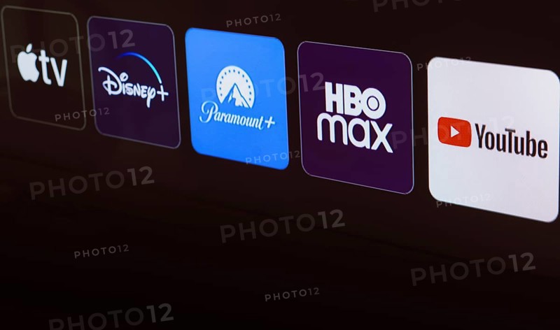 In this photo illustration the Apple TV, Disney Plus, Paramount Plus, HBO Max and YouTube logo is displayed on a TV screen