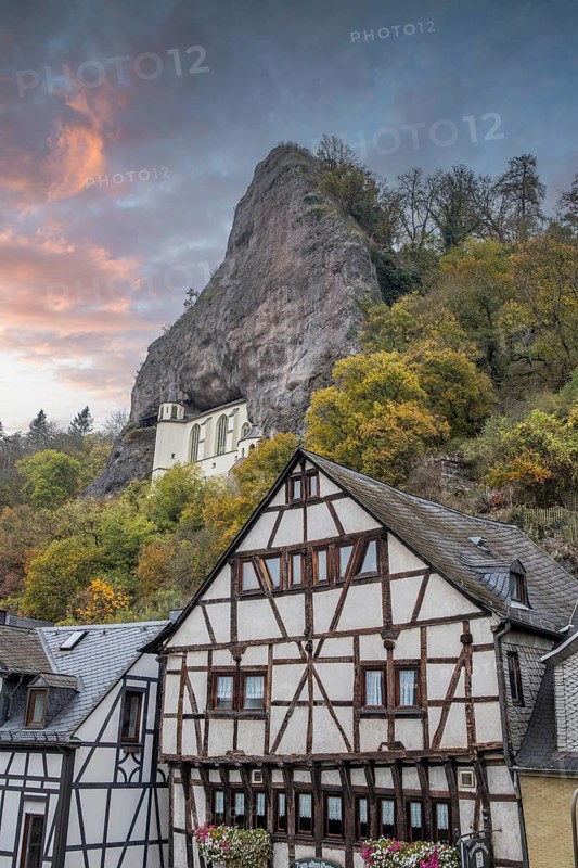 An old half-timbered town in autumn. A church was built into a rock here. Unique German architecture. Foggy landscape in the morning at the rock church, Idar-Oberstein, Rhineland-Palatinate, Germany, Europe