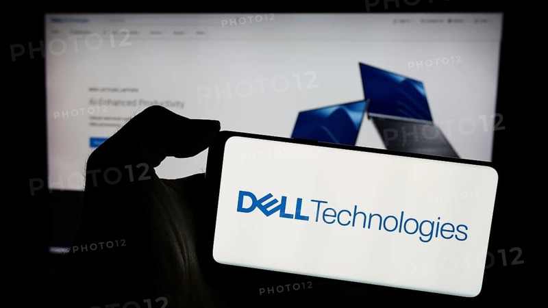 Stuttgart, Germany, 03-13-2024: Person holding mobile phone with logo of American technology company Dell Technologies Inc. in front of business web page. Focus on phone display, Europe