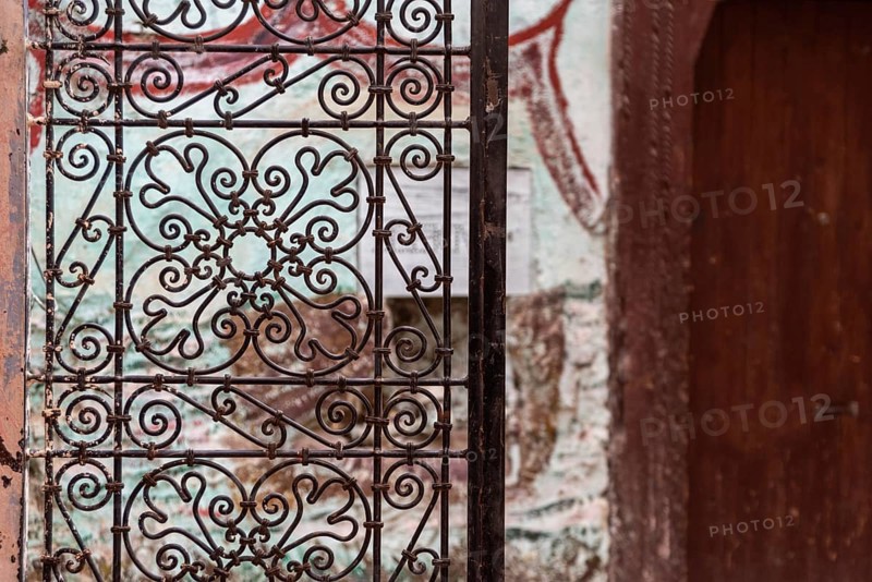 Old ornamental door grille with a floral pattern in the medina of Fes, Morocco, Africa