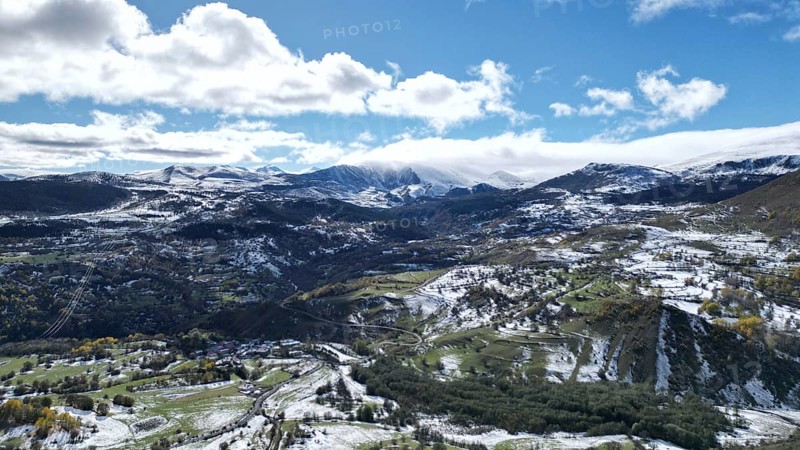 Expansive mountain landscape with snow-covered fields and a partly cloudy sky. Posof, Ardahan, TURKEY