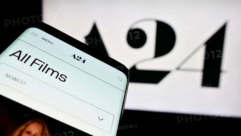 Stuttgart, Germany, 07-14-2024: Mobile phone with website of US entertainment company A24 Films LLC in front of business logo. Focus on top-left of phone display, Europe