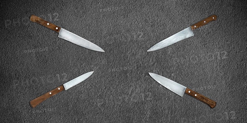 Topview of Set Cooking Knives on Dark Background