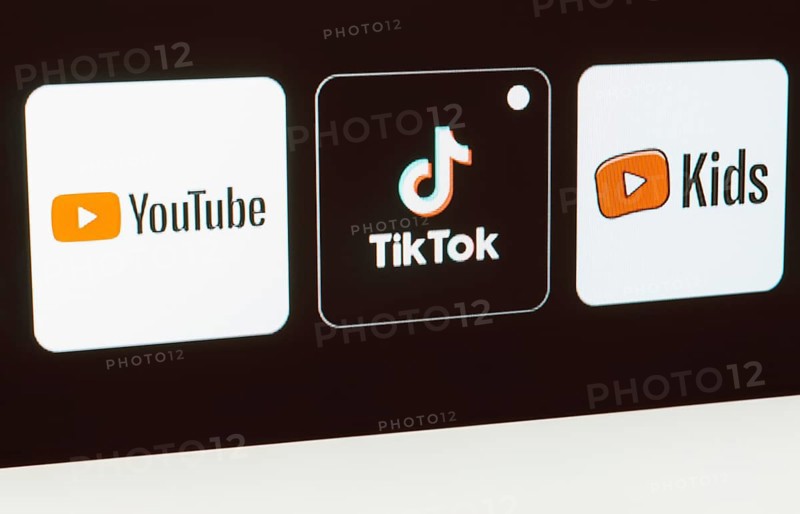 In this photo illustration the YouTube, TikTok, YouTube Kids logo is displayed on a TV screen