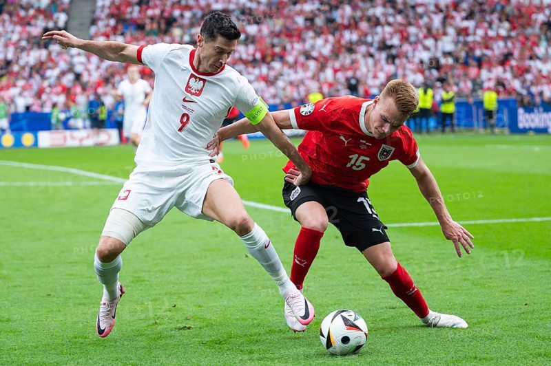 BERLIN, GERMANY - JUNE 21, 2024: Euro 2024 Groupe D match Poland vs Austria 1:3. Robert Lewandowski (L) Philipp Lienhart (R)