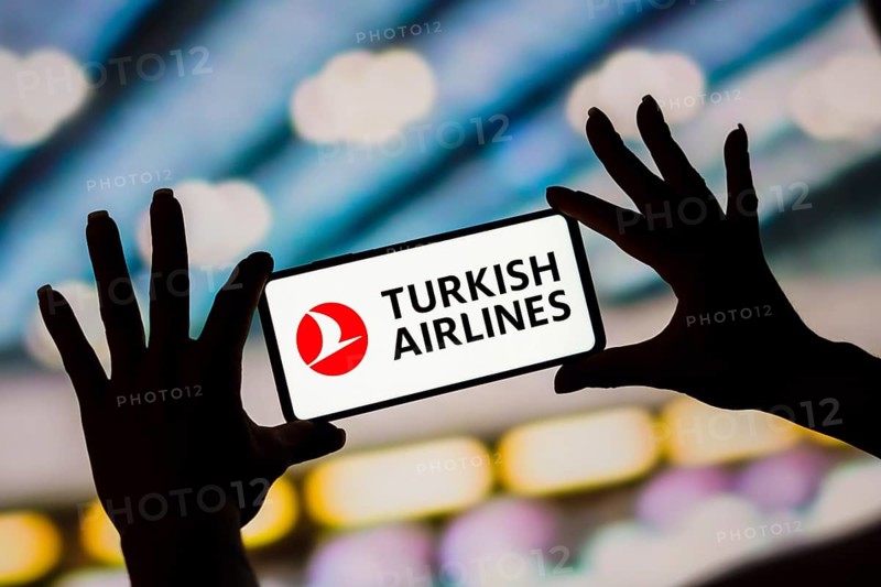 In this photo illustration, the Turkish Airlines logo is displayed on a smartphone screen