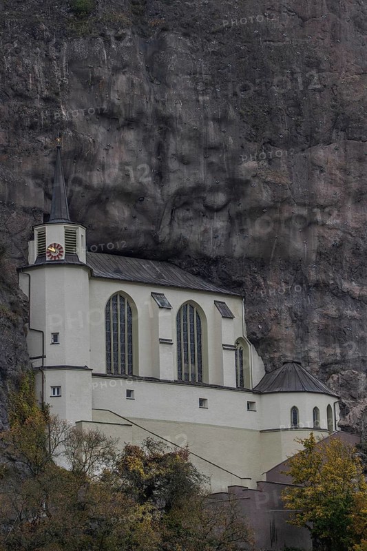 An old half-timbered town in autumn. A church was built into a rock here. Unique German architecture. Foggy landscape in the morning at the rock church, Idar-Oberstein, Rhineland-Palatinate, Germany, Europe