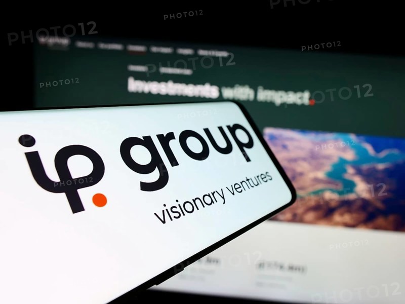 Stuttgart, Germany, 03-23-2024: Smartphone with logo of British intellectual property company IP Group plc in front of business website. Focus on center-left of phone display, Europe