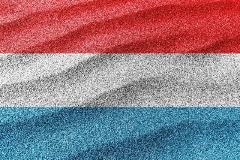 Luxembourg sand flag, national flag sand background