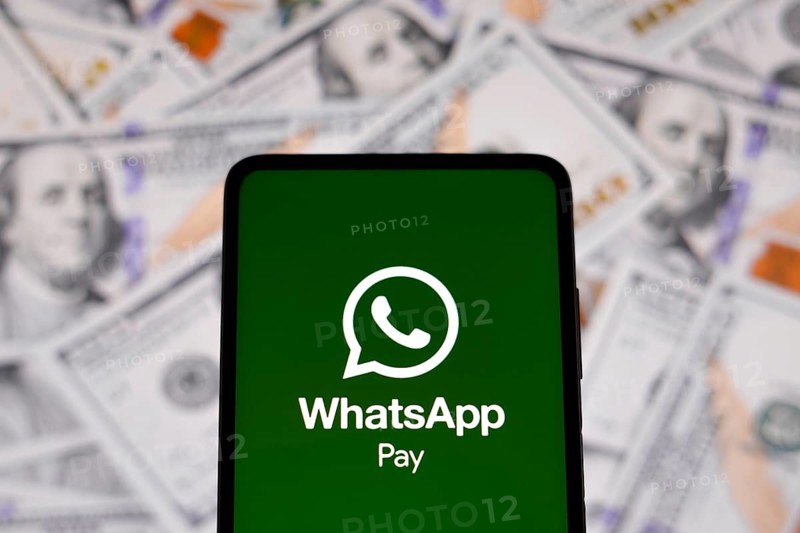 In this photo illustration the WhatsApp Pay logo seen displayed on a smartphone