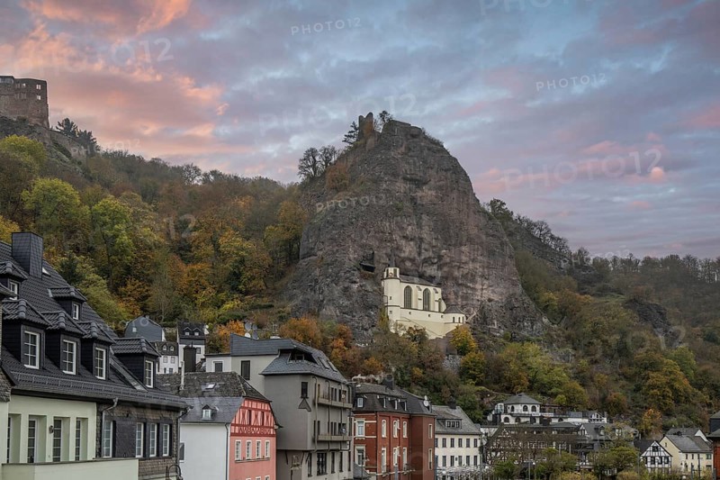 An old half-timbered town in autumn. A church was built into a rock here. Unique German architecture. Foggy landscape in the morning at the rock church, Idar-Oberstein, Rhineland-Palatinate, Germany, Europe