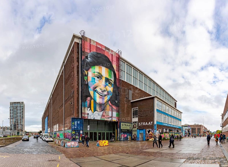 A picture of the Let Me Be Myself colorful mural, depicting Anne Frank, created by Eduardo Kobra in 2016, on the wall of the STRAAT Museum