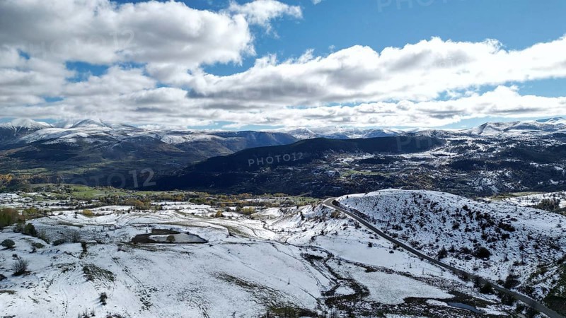 Bright panoramic view of a snow-covered mountainous region with a winding road. Posof, Ardahan, TURKEY