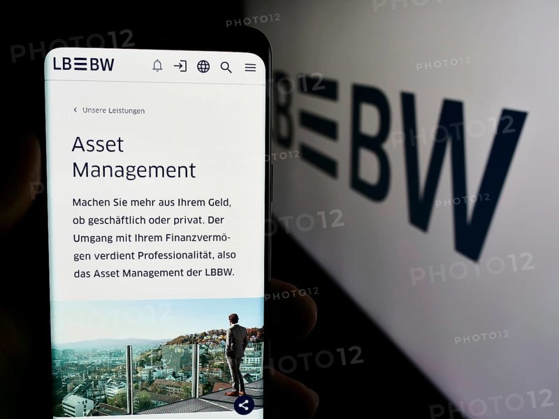 Stuttgart, Germany, 07-15-2024: Person holding smartphone with web page of German company Landesbank Baden-Wurttemberg (LBBW) in front of logo. Focus on center of phone display, Europe