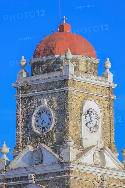Huayacocotla, Veracruz, Mexico. Jan 29, 2024. Top view of the clock from the Saint Peter the Apostle Parish, Catholic Church in Huayacocotla, Mexico, Central America