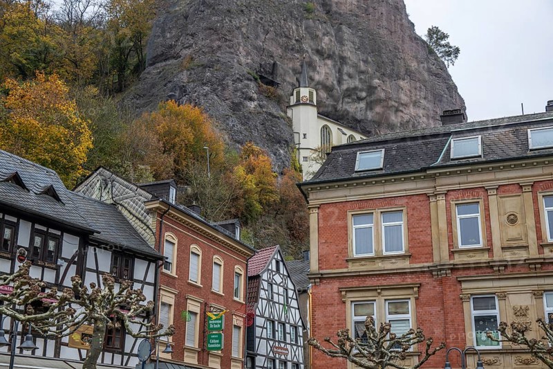 An old half-timbered town in autumn. A church was built into a rock here. Unique German architecture. Foggy landscape in the morning at the rock church, Idar-Oberstein, Rhineland-Palatinate, Germany, Europe
