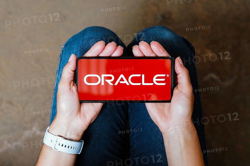 In this photo illustration, the Oracle Corporation logo is displayed on a smartphone screen