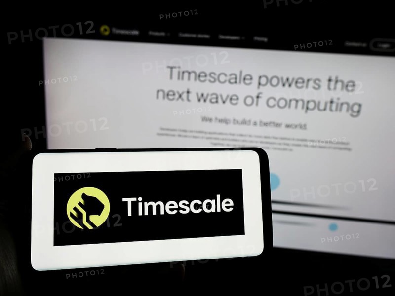 Stuttgart, Germany, 04-02-2024: Person holding smartphone with logo of US database software company Timescale Inc. in front of website. Focus on phone display, Europe