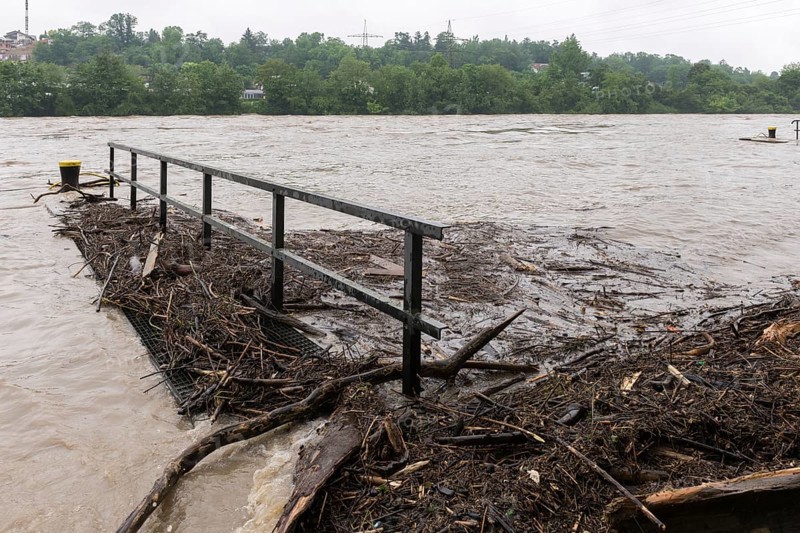 Symbolic image extreme weather, global warming, climate change, flood, washed up wood, footbridge, barrage on the Neckar river, Aldingen, Baden-Württemberg, Germany, Europe