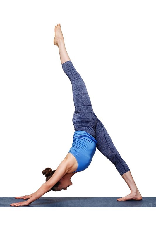 Woman doing Hatha yoga Eka pada adhomukha svanasana, one-legged downward facing dog on yoga mat isolated on white background