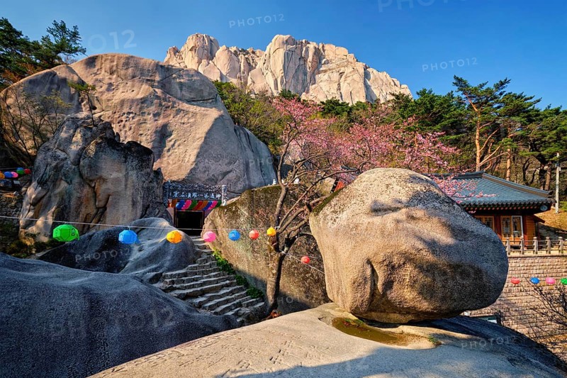 SEORAKSAN, SOUTH KOREA, APRIL 15, 2017: Kyejoam Seokgul Hermitage shrine and Ulsanbawi rock in Seoroksan National park, South Korea, Asia