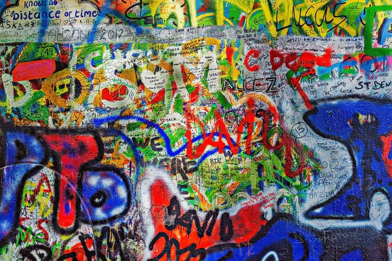 PRAGUE, CZECH REPUBLIC, APRIL 28, 2012: Lennon Wall is filled with John Lennon-inspired graffiti and pieces of lyrics from Beatles songs