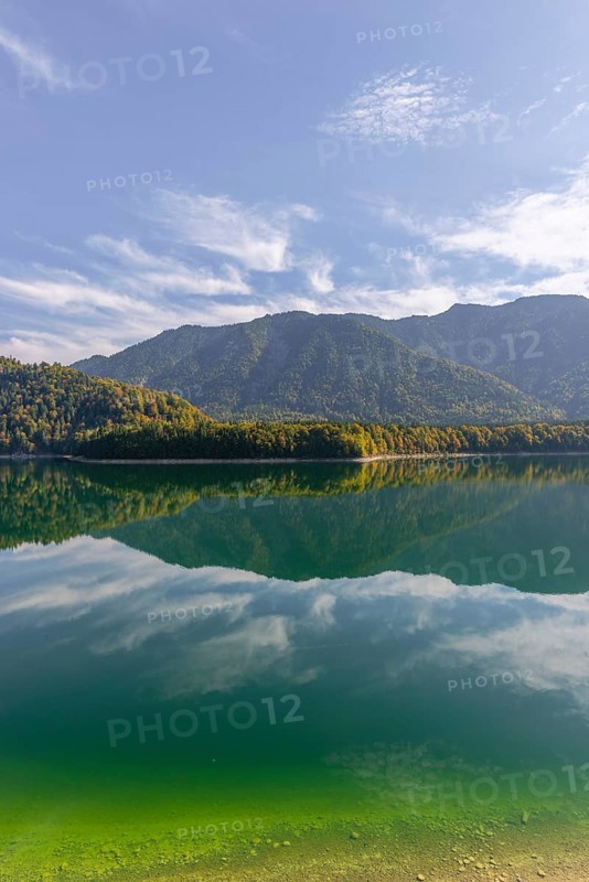 Intake structure at the Sylvenstein reservoir is used for flood protection, dams the Isar, power station, power generation, forest, water reflection, blue sky