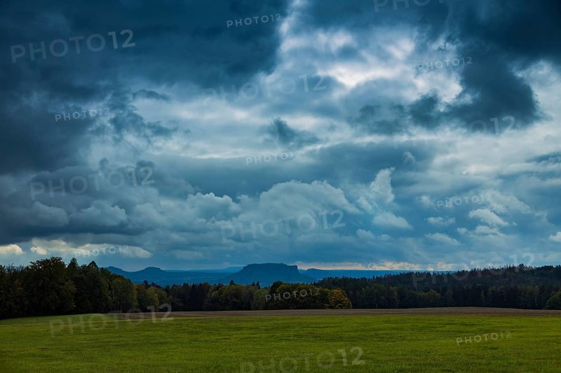 Dark clouds over the Lilienstein in Saxon Switzerland in the Basteige area