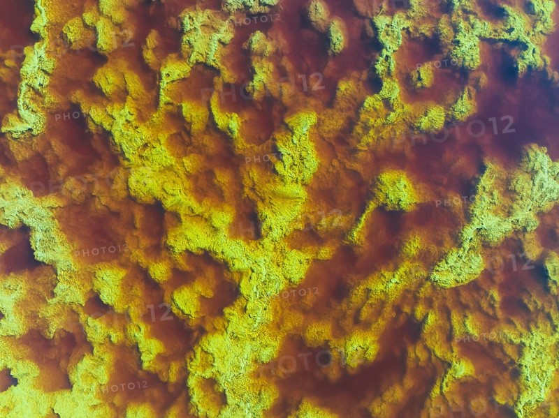 Detail of the Rio Tinto (Red river) with its reddish hue due to oxidised iron minerals and other mineral-rich deposits in its water, aerial view, drone shot, Huelva province, Andalusia, Spain, Europe