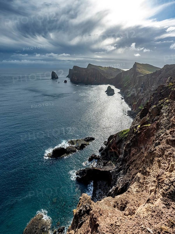 Red cliffs and rocks in the sea, coastal landscape with dramatic sky, Ponta de São Lourenço, volcanic peninsula São Lourenço, Ponta de San Lorenzo, Madeira, Portugal, Europe
