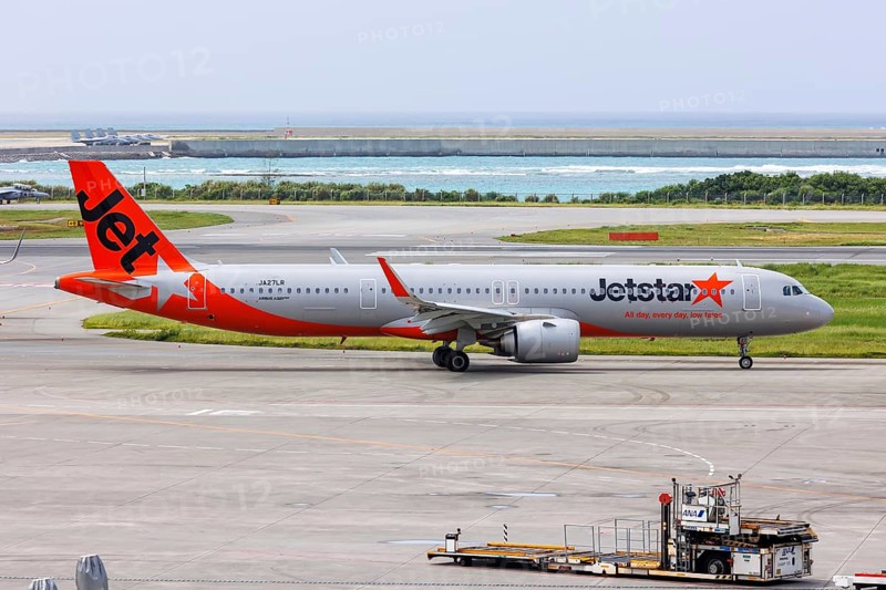 An Airbus A321neo aircraft of Jetstar Japan with the registration JA27LR at Okinawa Airport (OKA) in Naha, Japan, Asia