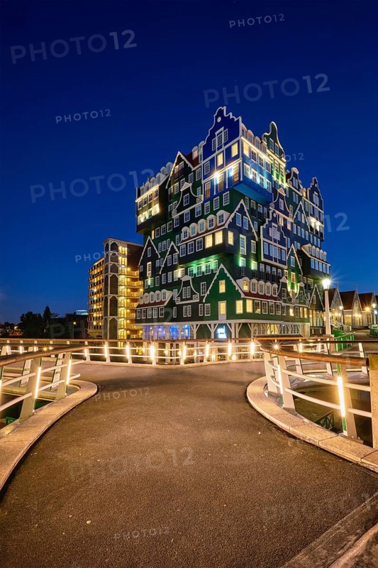 ZAANDAM, NETHERLANDS, MAY 8, 2017: Inntel Hotel in Zaandam illuminated at night. Design of 12-storey tall building opened in 2009 is the result of stacking a series of traditional Dutch houses