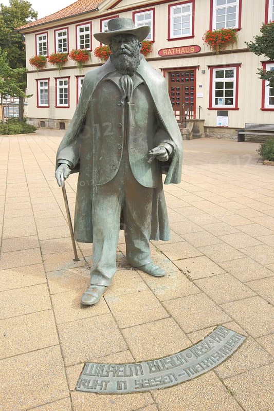 Town Hall Square, Rathausplatz with Monument and Statue of Wilhelm bush Monument, figure, sculpture, personality, man, stick, hatTown Hall, Seesen, Harz, Lower Saxony, Germany, Europe