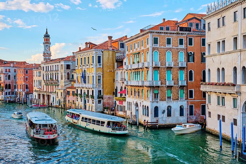 VENICE, ITALY, JUNE 27, 2018: Grand Canal with boats, vaporetto and gondolas on sunset from Rialto bridge, Venice, Italy, Europe