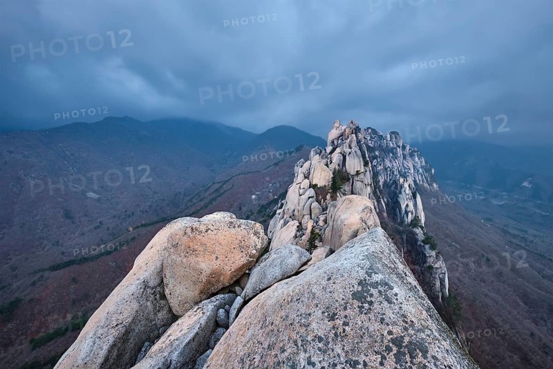 View of stones and rock formations from Ulsanbawi rock peak in stormy weather with clouds. Seoraksan National Park, South Corea