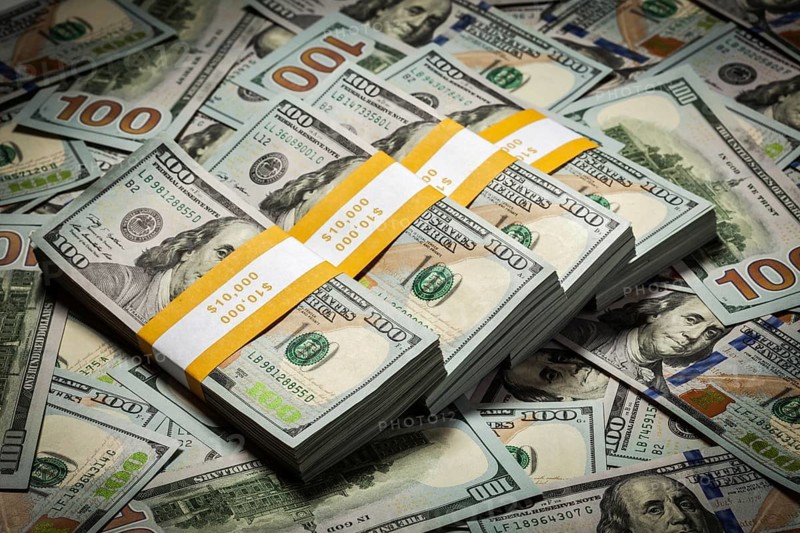 Creative business finance making money concept, background of new 100 US dollars 2013 edition banknotes bills bundles close up