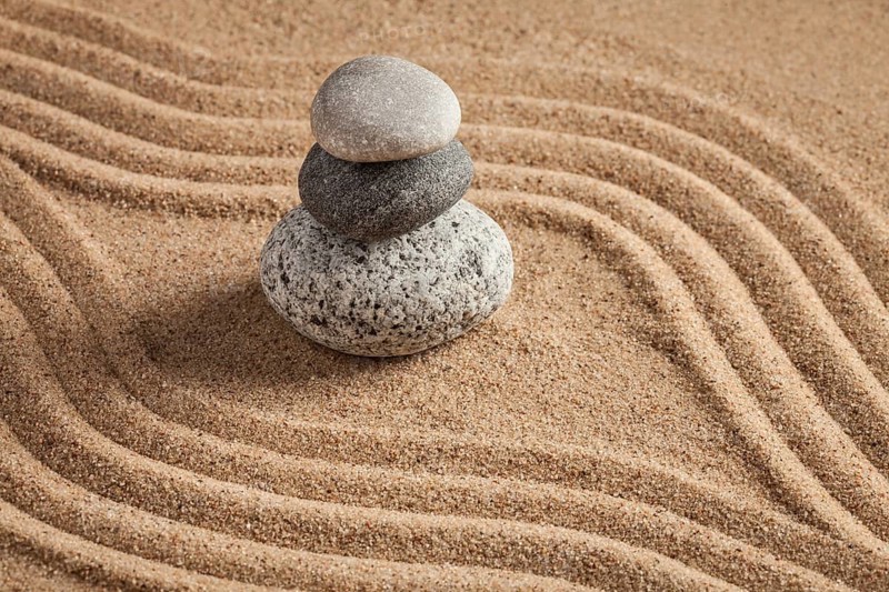Japanese Zen stone garden, relaxation, meditation, simplicity and balance concept, pebbles and raked sand tranquil calm scene