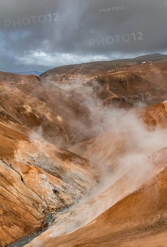 Steaming stream between colourful rhyolite mountains, Hveradalir geothermal area, Kerlingarfjöll, Icelandic highlands, Iceland, Europe