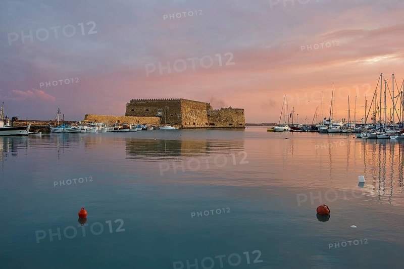 Sunset, evening light, backlight, Venetian sea fortress, Koules, Morosini, mountains, bronze sky, harbour, Heraklion, capital, island of Crete, Greece, Europe