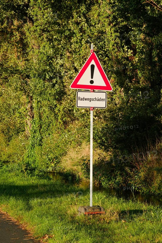 Cycle path damage, traffic sign, general danger zone, Emsland, Lower Saxony, Germany, Europe
