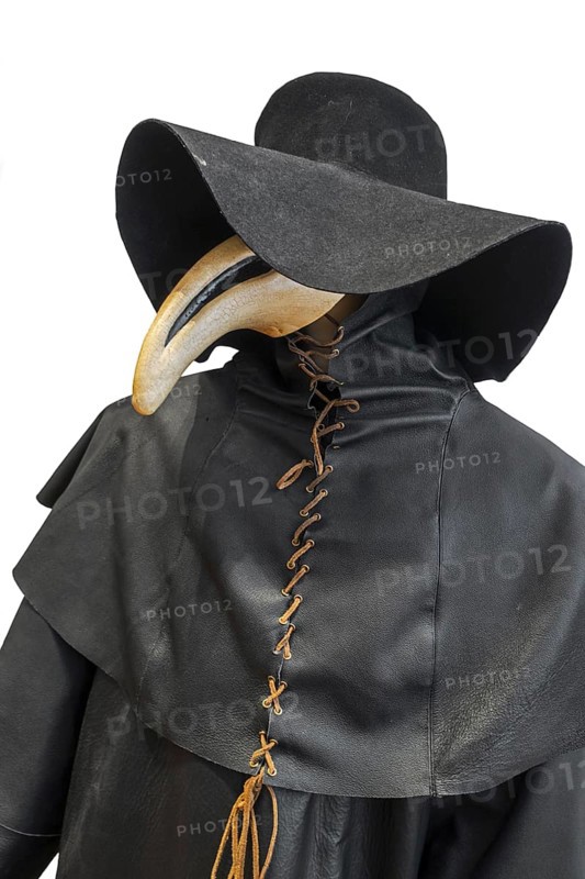 Black wide-brimmed hat, overcoat and beaked mask for plague doctor to treat victims of bubonic plague during epidemic on white background
