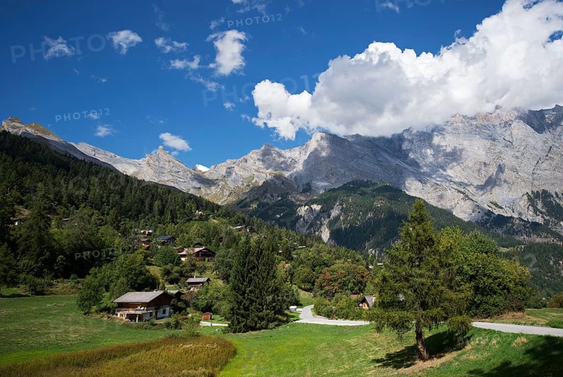Mountain village of Mayens-de-Chamoson surrounded by the Dent de Chamosentze peak and the limestone cliffs of the Haut de Cry massif, Mayens-de-Chamoson, Valais, Switzerland, Europe