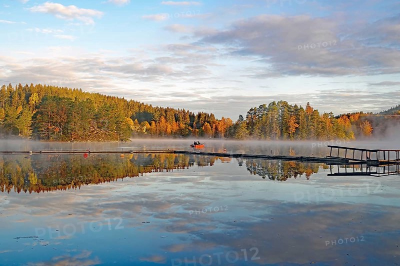 Fog drifts over a calm lake, foliage colouring, October, Bullaren, Västrä Götland, Sweden, Europe
