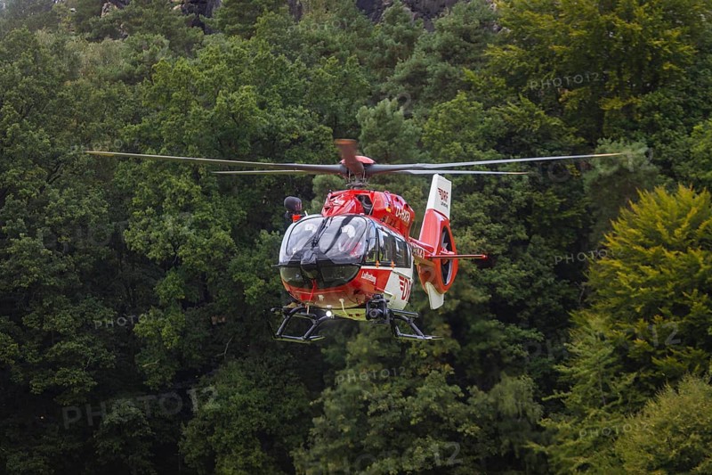 Winch rescue training of the rescue helicopter, Christoph 62, on the occasion of the 50th anniversary of the DRF Luftrettung. The rescue of casualties in the Elbe Sandstone Mountains will be practised