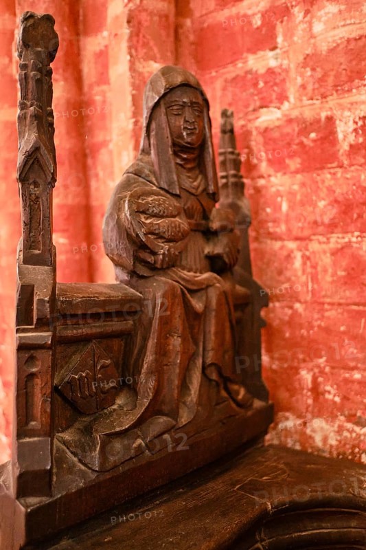 Carved wooden figures on Gothic choir stalls, Nikolaikirche Hanseatic City of Wismar, Mecklenburg-Western Pomerania, Germany, Europe