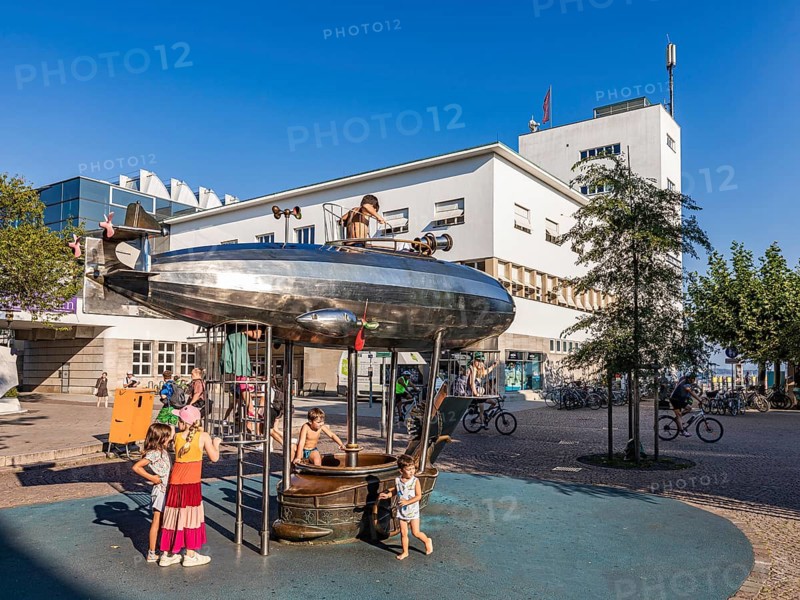 Children on a playground with a play zeppelin in front of the Zeppelin Museum, Friedrichshafen, Lake Constance, Baden-Württemberg, Germany, Europe