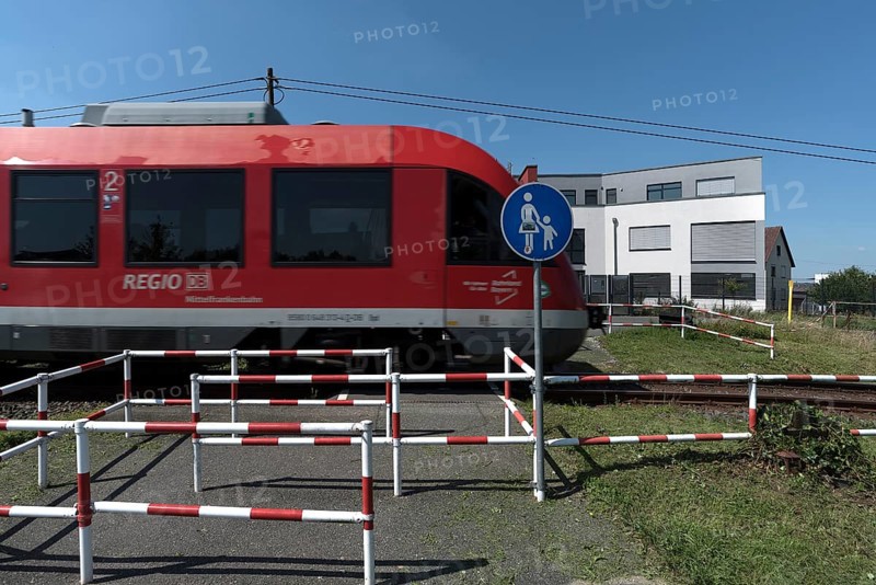 Suburban railway crossing an ungated pedestrian crossing, Eckental Middle Franconia, Bavaria, Germany, Europe