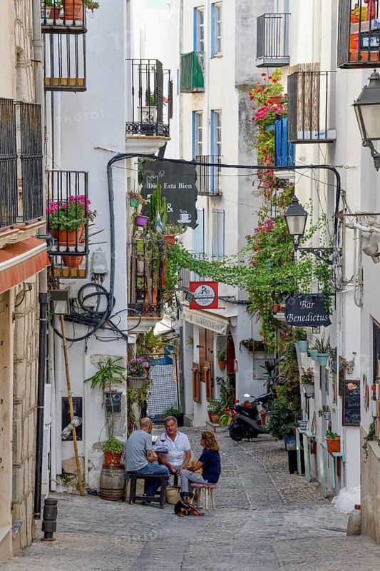 People in a sidewalk café in the old town of Peñíscola, Castellón province, Costa del Azahar, Valencia region, Spain, Europe