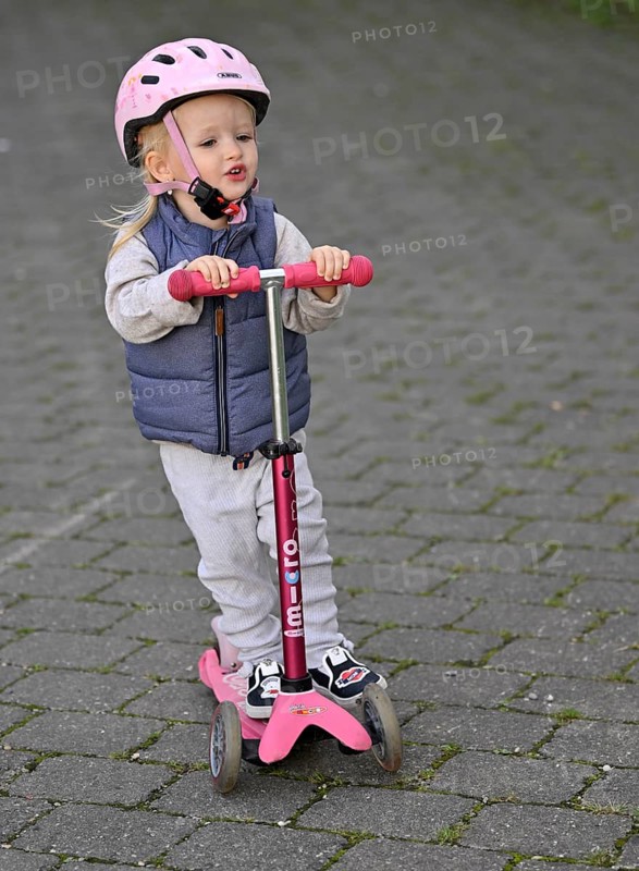 Little girl, 2 years, blond, helmet, pink, rides scooter, scooter, Stuttgart, Baden-Württemberg, Germany, Europe