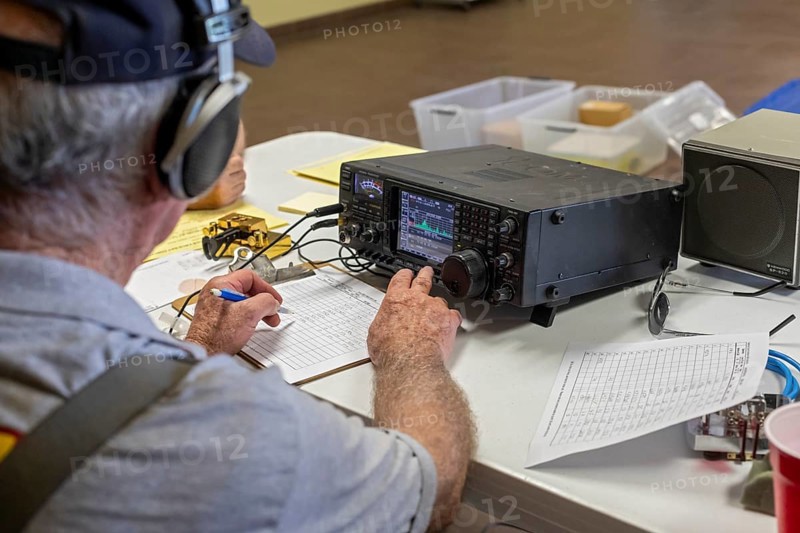 Bosque Farms, New Mexico, Paul Ridley, an amateur radio operator, operates a Morse code station during the American Radio Relay League's annual field day. During this event, members set up their equipment in a public place and attempt to contact as many other stations as possible